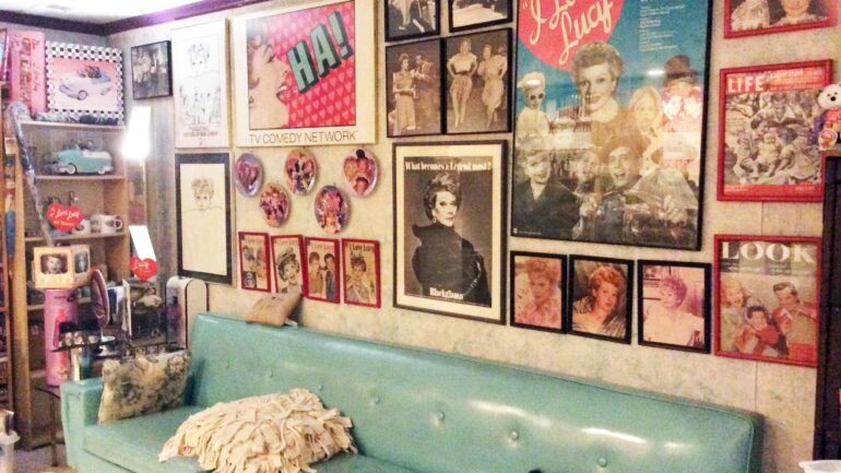 Glen Charlow displays some of his Lucille Ball collection, which includes posters, plates, glossy images and more.