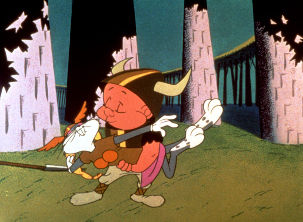 Bugs Bunny, in operatic Valkyrie attire, and Elmer Fudd, in a horned helmet, in a scene parodying Richard Wagner's 'Ring' opera in the Merrie Melodies cartoon What's Opera, Doc? (1957)