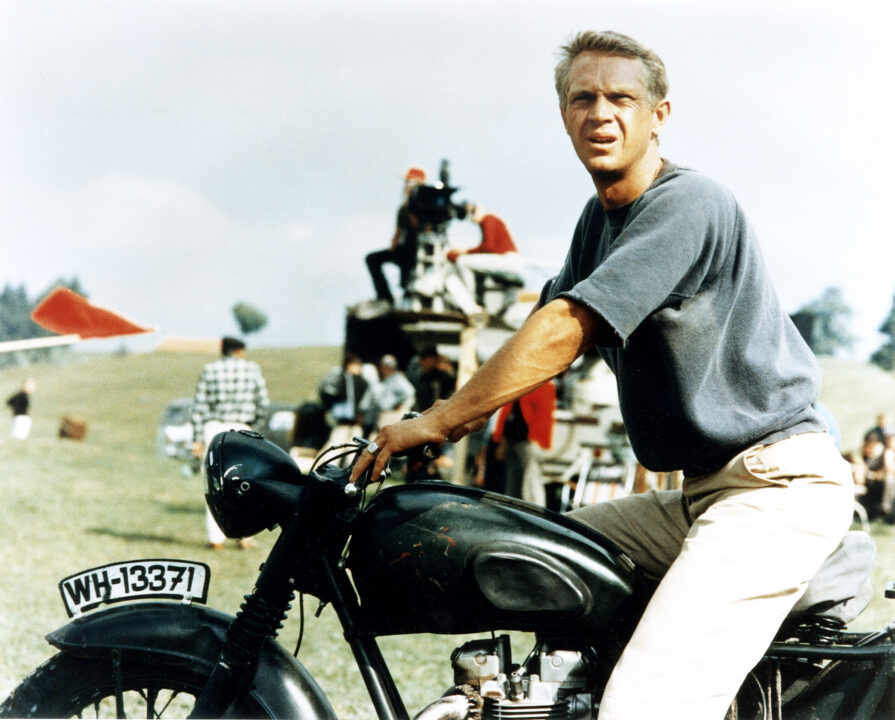 Steve McQueen with motorcycle on the set of GREAT ESCAPE, 1963