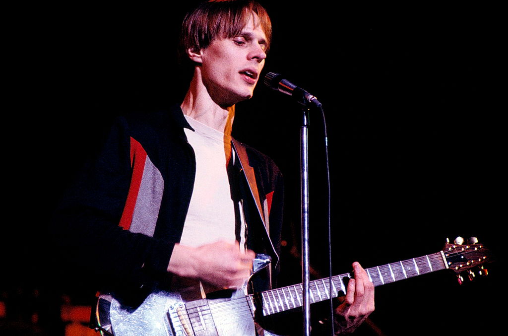 Television perform at the Bottom Line club, New York, June 1978, Tom Verlaine. He plays an Ampeg Dan Armstrong transparent perspex guitar