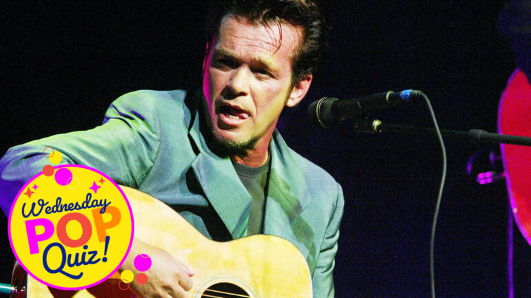John Cougar playing guitar