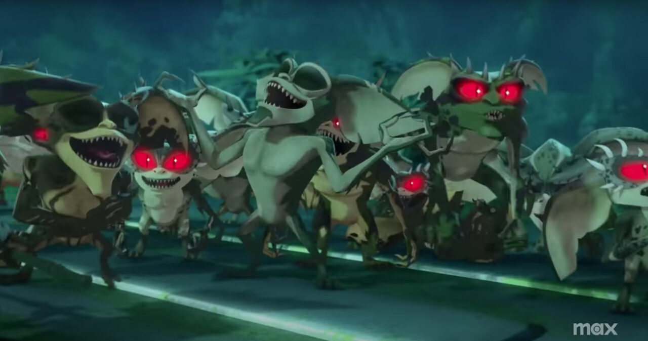 several green-bodied, red-eyed gremlins laughing diabolically as they gather around a seeming leader of the group in a scene from the teaser for the animated series "Gremlins: Secrets of the Mogwai"