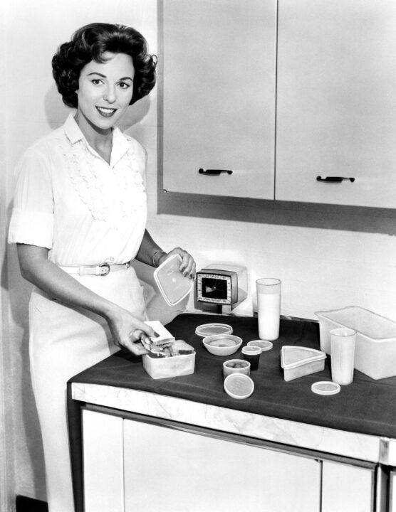 THE BIG PAYOFF, host Bess Myerson, plugging sponsor Tupperware, 1951-59 (ca. late 1950s photo)
