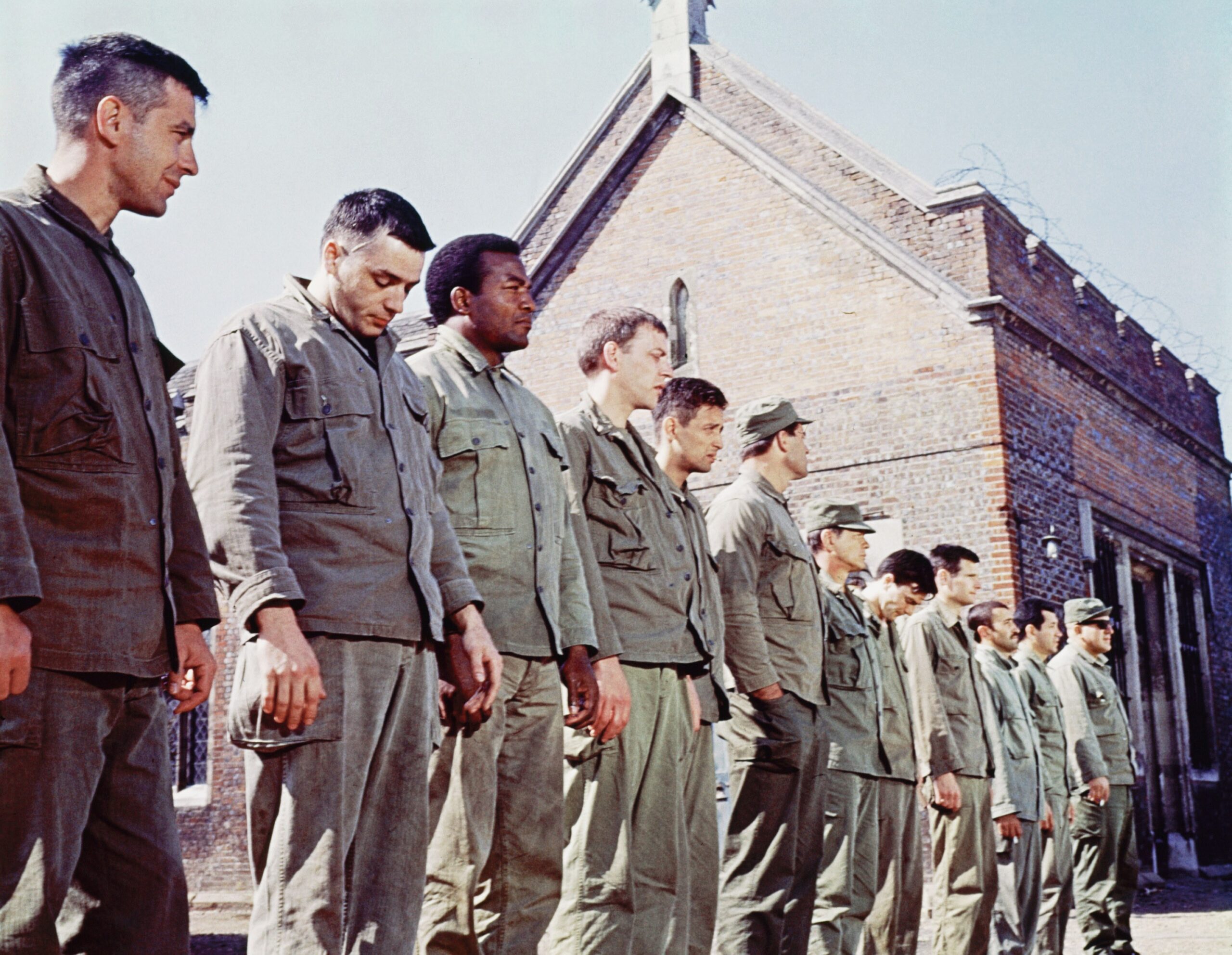 THE DIRTY DOZEN, from left: John Cassavetes, Tom Busby, Jim Brown, Donald Sutherland, Ben Carruthers, Clint Walker, Charles Bronson, Colin Maitland, Stuart Cooper, Al Mancini, Trini Lopez, Telly Savalas, 1967 