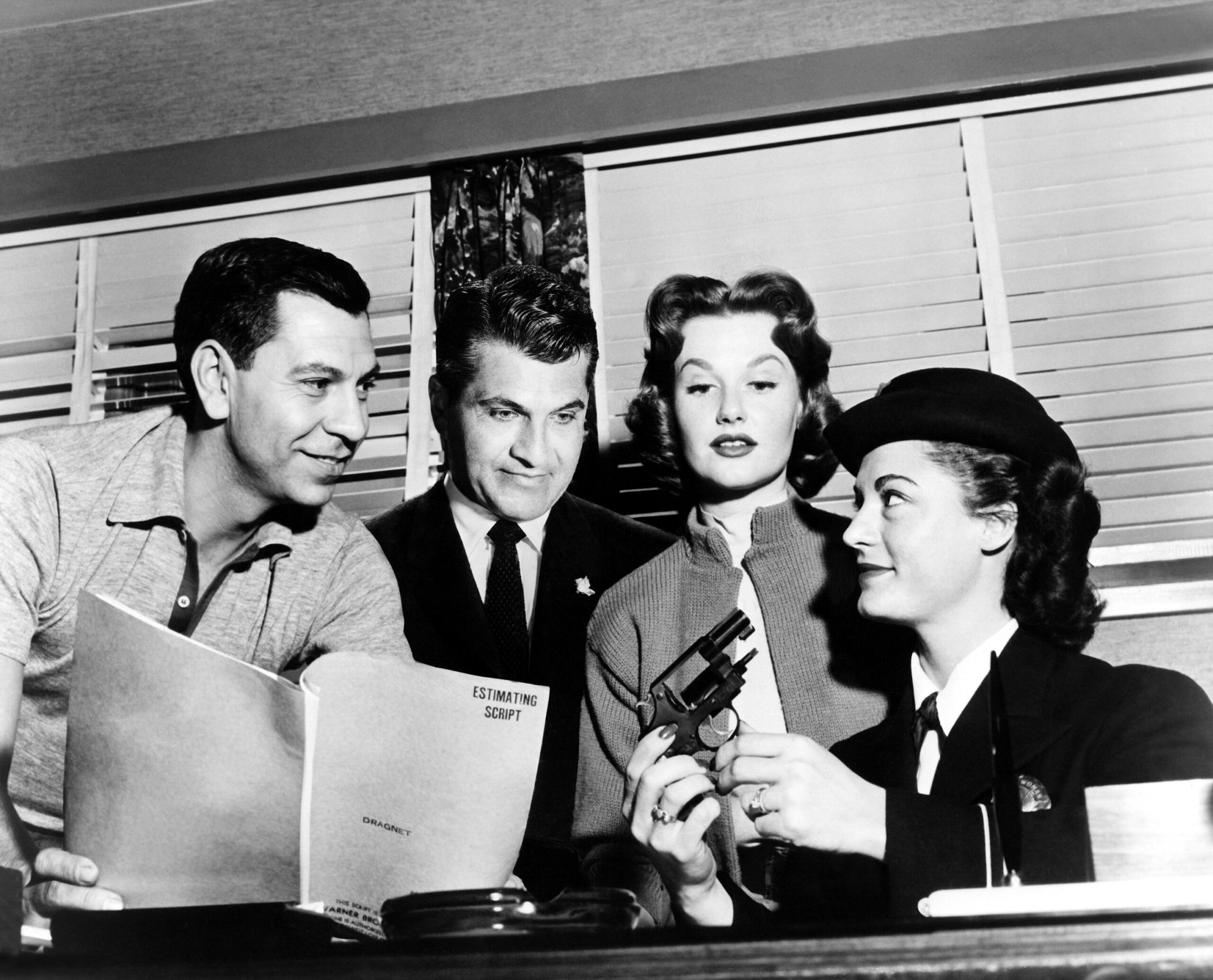 DRAGNET, from left, director and star Jack Webb, producer Stanley Meyer, Ann Robinson, technical advisor Margaret Groth, on-set, 1954