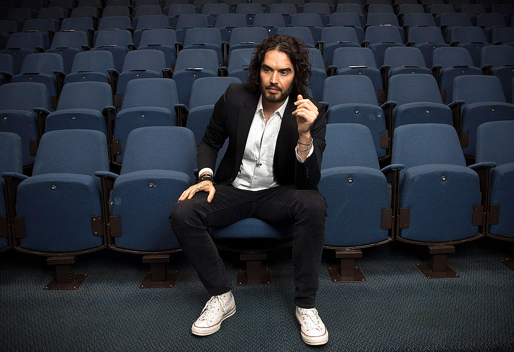 LONDON, ENGLAND - NOVEMBER 25: Russell Brand poses for photographs as he arrives to deliver The Reading Agency Lecture at The Institute of Education on November 25, 2014 in London, England. Russell Brand will deliver 'a manifesto on reading' which will be in part personal, sharing his own experience of books and reading while growing up in the UK. 