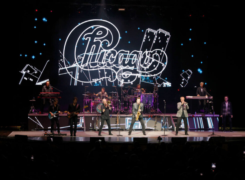 NASHVILLE, TENNESSEE - DECEMBER 15: Lou Pardini, Tony Obrohta, Brett Simons, James Pankow, Walfredo Reyes Jr., Ray Herrmann, Ramon Yslas, Lee Loughnane, Robert Lamm and Neil Donell of the band Chicago perform at The Grand Ole Opry on December 15, 2021 in Nashville, Tennessee