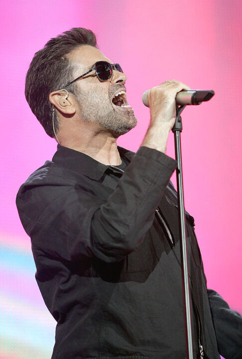 LONDON - JULY 02: Singer George Michael performs on stage at "Live 8 London" in Hyde Park on July 2, 2005 in London, England. The free concert is one of ten simultaneous international gigs including Philadelphia, Berlin, Rome, Paris, Barrie, Tokyo, Cornwall, Moscow and Johannesburg. The concerts precede the G8 summit (July 6-8) to raising awareness for MAKEpovertyHISTORY