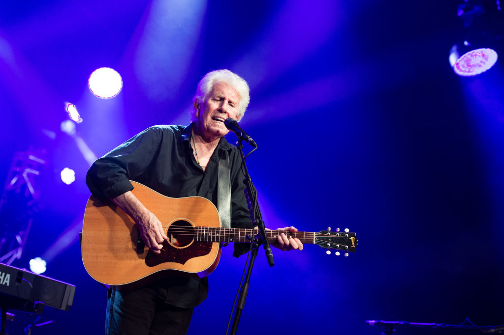 CAMBRIDGE, ENGLAND - AUGUST 02: Graham Nash performs on stage during the Cambridge Folk Festival 2019 at Cherry Hinton Hall on August 02, 2019 in Cambridge, England