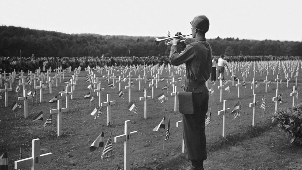 A US soldier plays taps at the Luxembourg American Cemetery in a Memorial Day service honoring the American soldiers who gave their lives in World War II, Hamm, Luxembourg, May 30, 1946. (Photo by Underwood Archives/Getty Images)