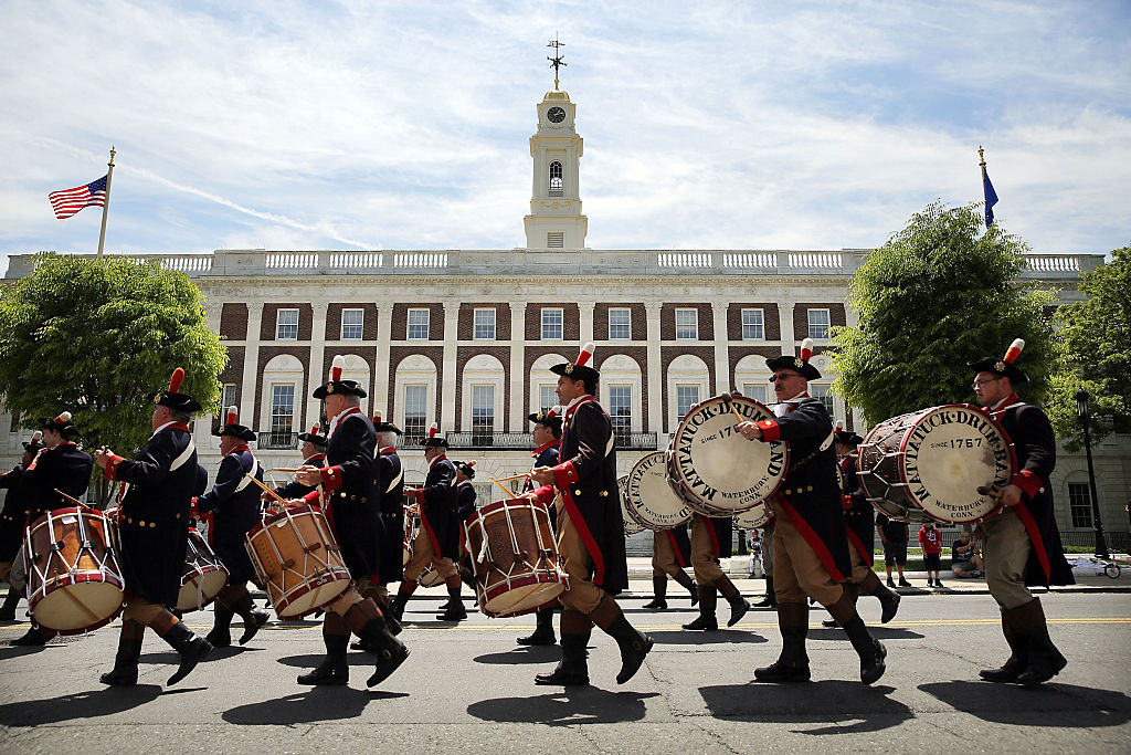 WATERBURY, CT - MAY 24: Marchers play drums during the Memorial Day Parade as it passes through downtown on May 24, 2015 in Waterbury, Connecticut. Across America towns and cities will be celebrating veterans of the United States Armed Forces and the sacrifices they have made. Memorial Day is a federal holiday in America and has been celebrated since the end of the Civil War