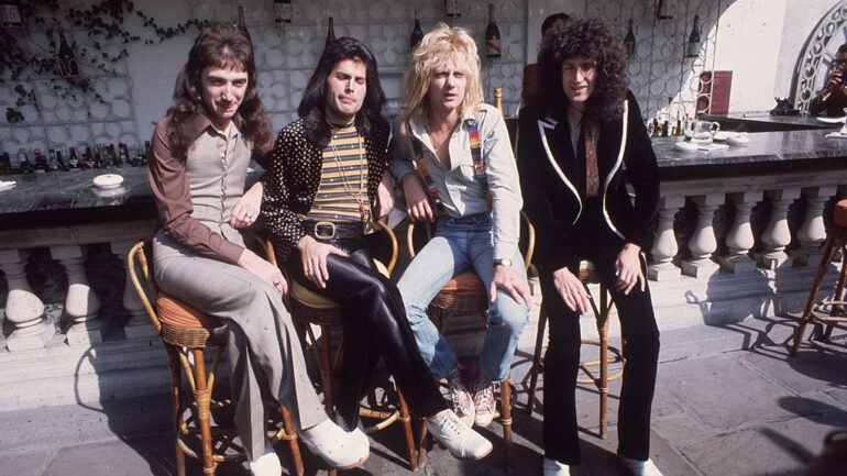 8th September 1976: British rock group Queen at Les Ambassadeurs, where they were presented with silver, gold and platinum discs for sales in excess of one million of their hit single 'Bohemian Rhapsody'. The band are, from left to right, John Deacon, Freddie Mercury (Frederick Bulsara, 1946 - 1991), Roger Taylor and Brian May.