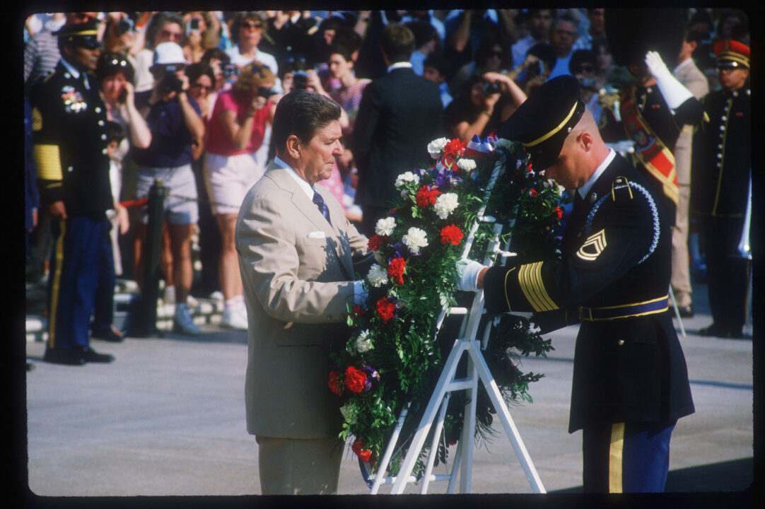 037469 01: (NO NEWSWEEK - NO US NEWS) President Ronald Reagan observes Memorial Day at the National Cemetery May 27, 1985 in Arlington, VA. Reagan's administration was marked by economic recovery, military involvement in Grenada, Central America, Lebanon, and Libya, and improved relations with the Soviet Union. 