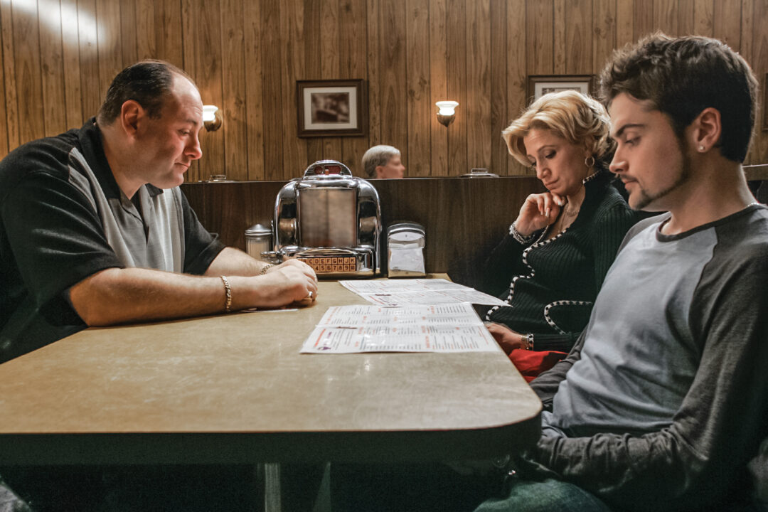 THE SOPRANOS Series Finale: James Gandolfini, Edie Falco, Robert Iler. photo: Craig BlankenhornThe Sopranos (P621) "Made In America" 03-22-2007 Director: David Chase DP: Alik Sakharov Scene 61-63-65-67 (int) Holsten's Diner "The gang shows up for family dinner" James Gandolfini (Tony Soprano) Edie Falco (Carmela) Robert Iler (Anthony Jr.) 