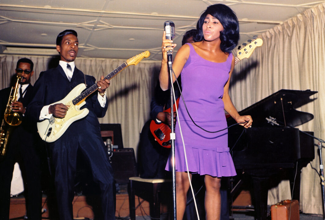 DALLAS FORT WORTH, TX - 1964: Husband-and-wife R&B duo Ike & Tina Turner perform onstage with a Fender Stratocaster electric guitar in 1964 in Dallas Fort Worth, Texas. 
