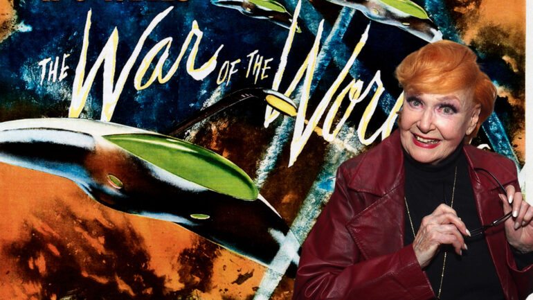 Ann Robinson 2019 with War of the Worlds poster art