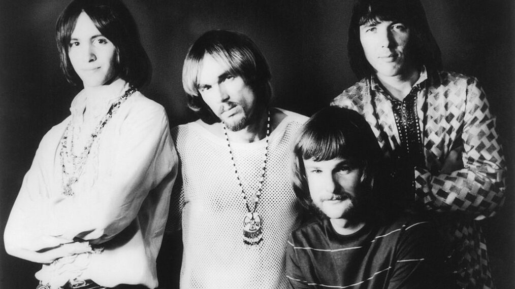 a black-and-white photo of the rock band Iron Butterfly from 1969. Left to right are Erik Brann, Ron Bushy, Lee Dorman and Doug Ingle. They are all white men with long hair fashionable at the time. Bushy has a mustache and goatee; Dorman a mustache; the other two are clean-shaven.