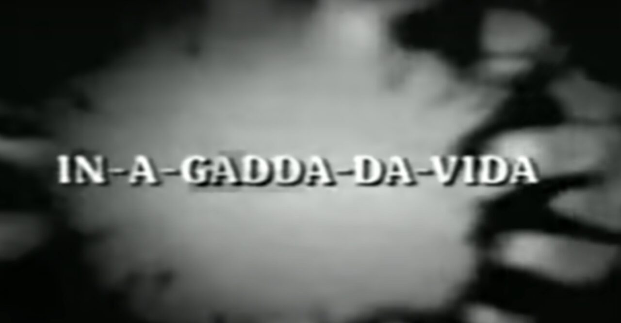 Introductory title from a video featuring a 1968 performance of "In-A-Gadda-Da-Vida" by Iron Butterfuly. The image is in black and white, with the song title spelled out in white lettering across a background of swirling psychedelic imagery.