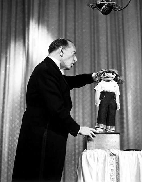 black and white photo of ventriloquist Senor Wences and his literal hand puppet, Johnny, in a circa 1960 episode of "The Ed Sullivan Show"