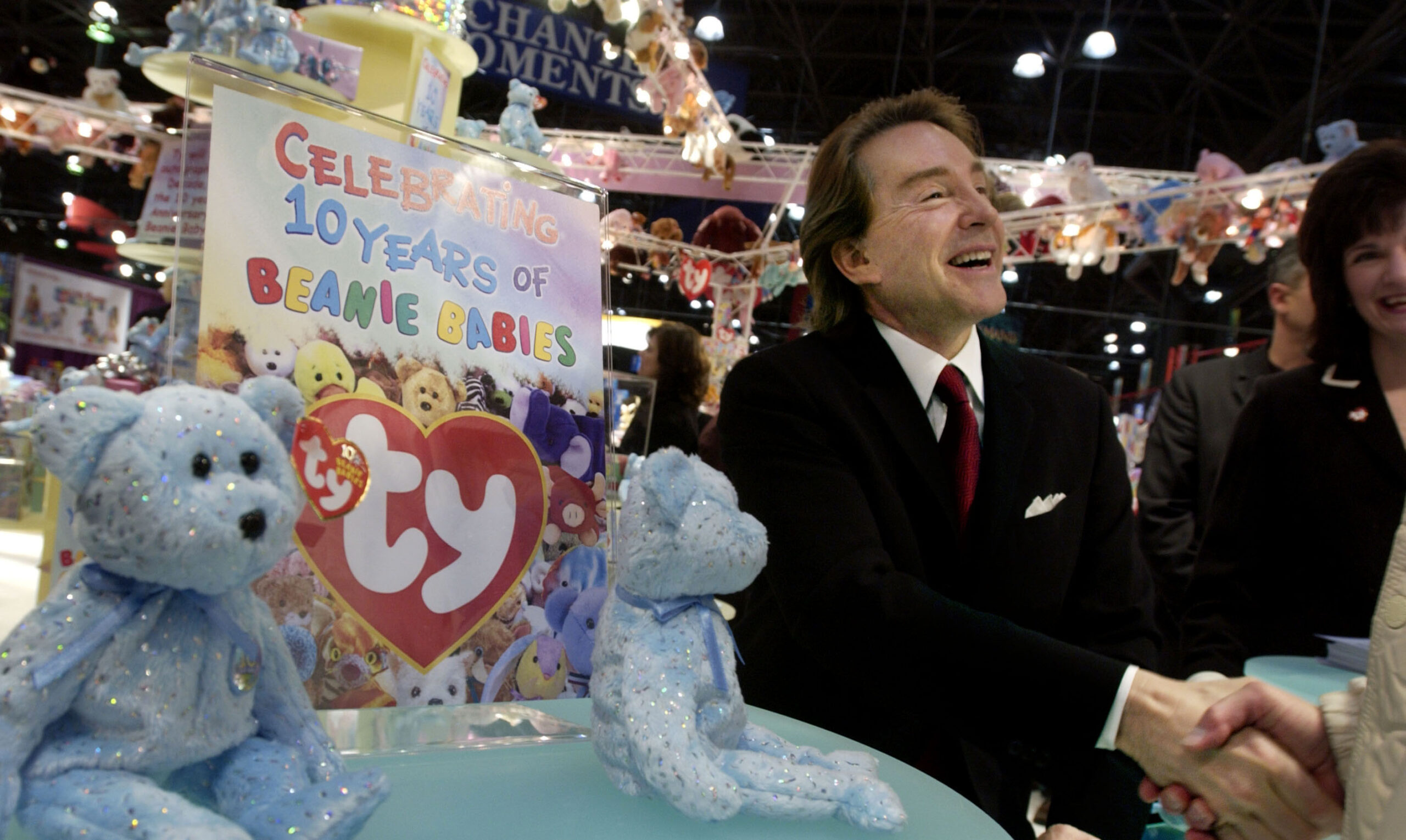 Ty Warner, creator of Beanie Babies toys, shakes hands in a rare appearance to celebrate the 10th anniversary of the Beanie Babies toy line at the American International Toy Fair February 16, 2003 