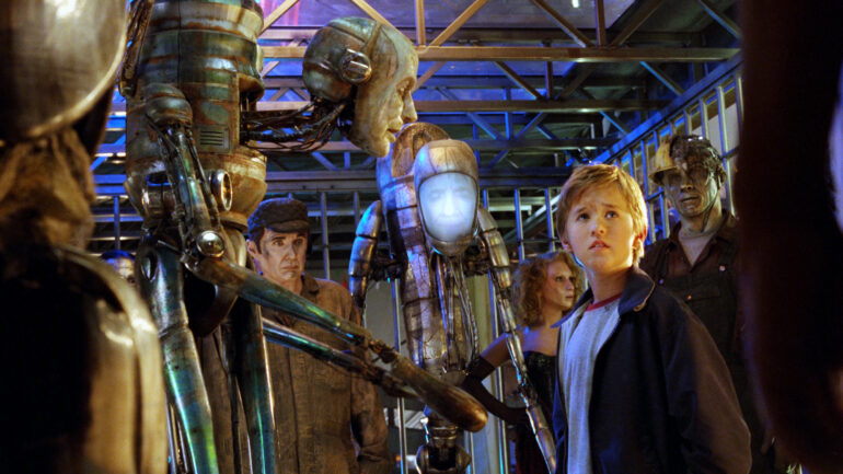 A.I. ARTIFICIAL INTELLIGENCE, Haley Joel Osment with uncredited robots, 2001.
