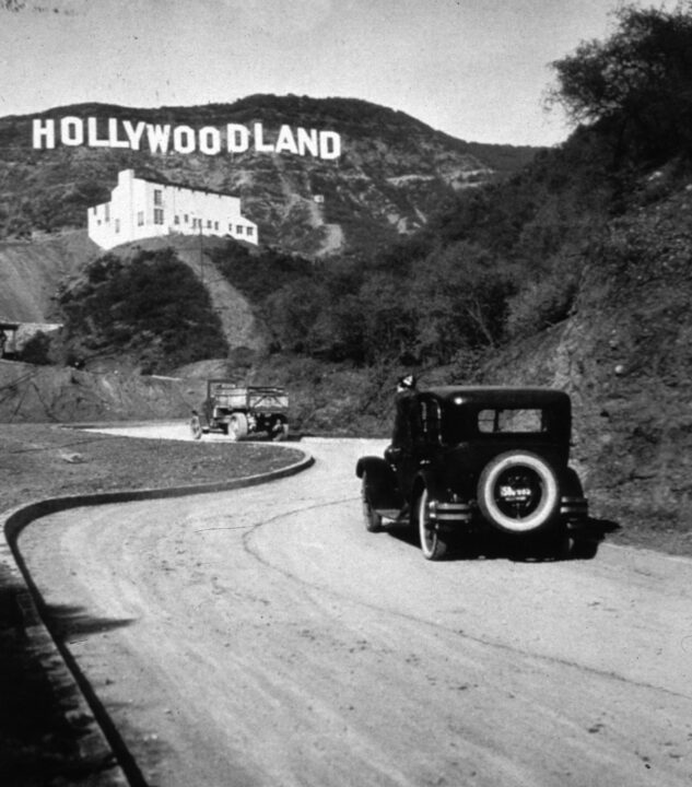 The Hollywoodland sign in Los Angeles marking the centre of America's film and television industries. It was later changed to read 'Hollywood'.
