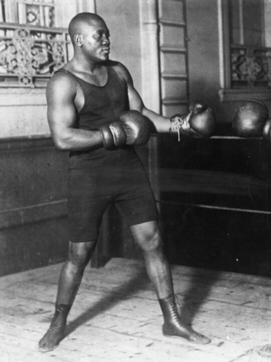 American heavyweight boxer Jack Johnson in action sparring. 