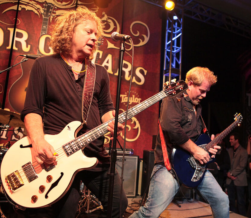 ANAHEIM, CA - JANUARY 14: Recording artists Jack Blades (L) and Brad Gillis of the group Night Ranger perform on the Taylor Guitars Stage at the 2011 NAMM Show - Day 3 at the Anaheim Convention Center on January 14, 2011 in Anaheim, California