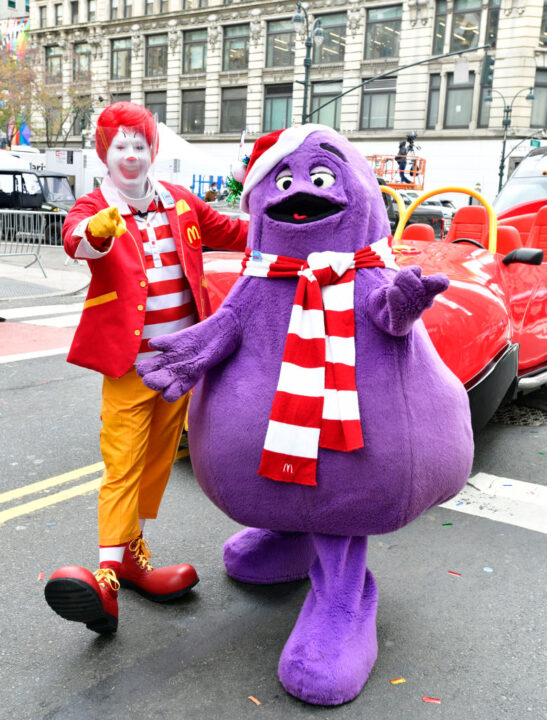 NEW YORK, NEW YORK - NOVEMBER 24: Ronald McDonald (wearing face shield) and Grimace appear in the 94th Annual Macy's Thanksgiving Day Parade¨ on November 24, 2020 in New York City. The World-Famous Macy's Thanksgiving Day Parade¨ kicks off the holiday season for millions of television viewers watching safely at home
