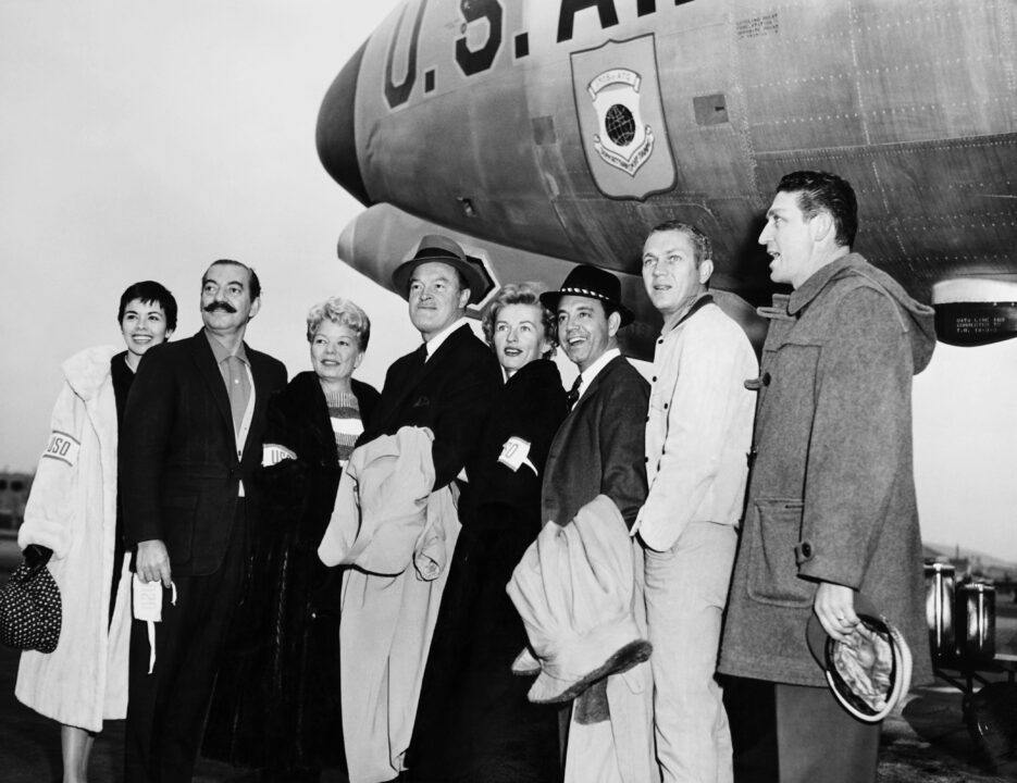 THE BOB HOPE SHOW, from left: Neile Adams McQueen, Jerry Colonna, Frances Langford, Bob Hope, Patti Thomas, Tony Romano, Steve McQueen, Peter Leeds, on their way to Asia to film the TV special, (aired Jan. 13, 1960).