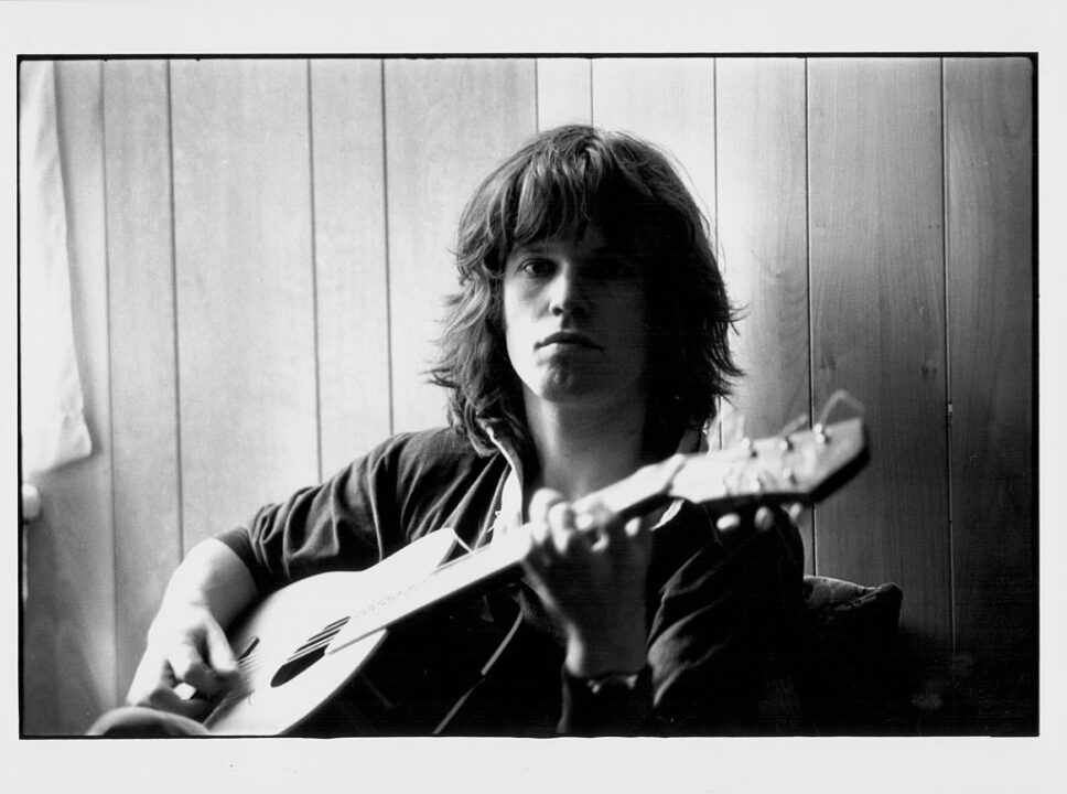 Portrait of musician Chris Jagger with his guitar, brother of pop singer Mick Jagger, circa 1968.