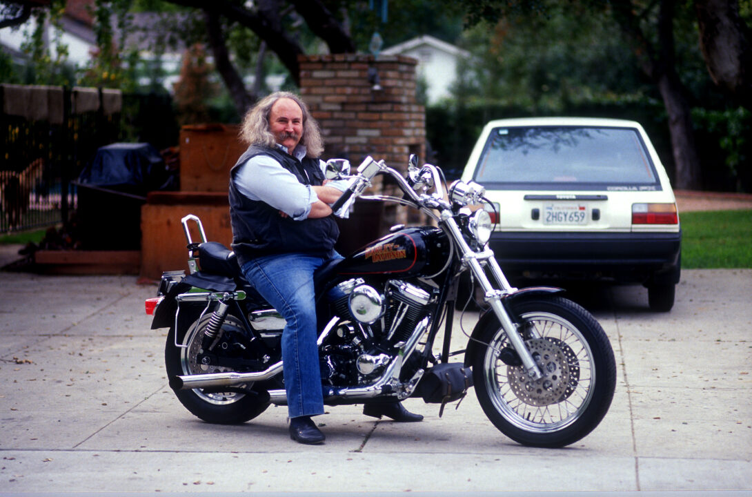 SHERMAN OAKS, CA - JUNE 1: David Crosby photographed just after he had written a book about his lifetime struggle with alcohol and drugs . In January 2000, Melissa Etheridge announced that Crosby was the biological father of two children Julie Cypher gave birth to by means of artificial insemination. At the time, Etheridge and Cypher were in a relationship. Photographed at his Sherman Oaks home on a Harley Davidson June 1, 1991 in Sherman Oaks, California 