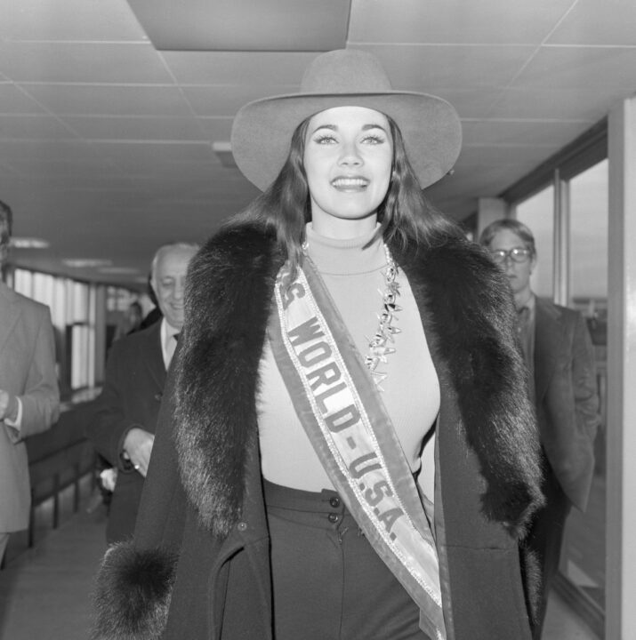 (Original Caption) LONDON AIRPORT: Miss USA, Lynda Carter from Phoenix, Arizona, wears cowboy style hat as she arrives here 11/22. She is in the country for the Miss World contest, due to take place 11/30.