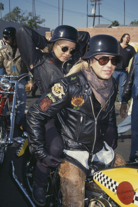 American singer-songwriter Bret Michaels and Canadian actress Pamela Anderson attend Love Ride 11, the 11th Annual Motorcycle Rider's Fundraiser for the Muscular Dystrophy Association, held at a Harley-Davidson dealership in Glendale, California, 13th November 1994. 