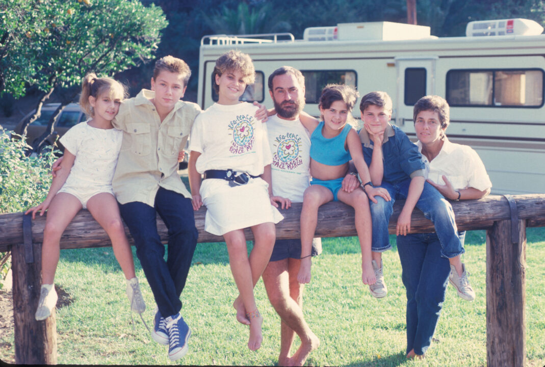 The Phoenix Family next to the RV they travel in when they do missionary work, at their home in Los Angeles, California, US, circa 1986; L-R Summer Phoenix, River Phoenix, Liberty Phoenix, John Lee Phoenix, Rain Phoenix, Joaquin Phoenix, Arlyn Phoenix. 