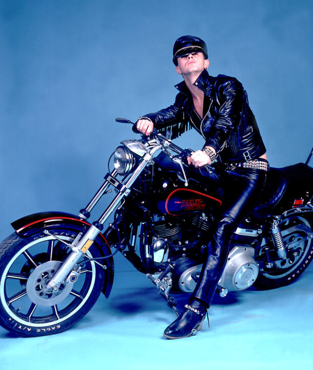 Portrait of British singer Rob Halford of the heavy metal group Judas Priest poses on a motorcycle backstage at the International Ampitheater, Chicago, Illinois, May 9, 1981.