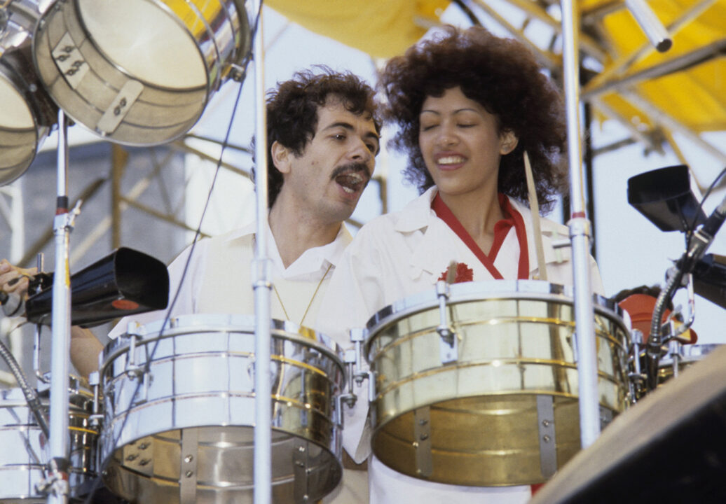OAKLAND - 1977: L-R Carlos Santana and Sheila E perform live at The Oakland Coliseum in 1977 in Oakland, California. 