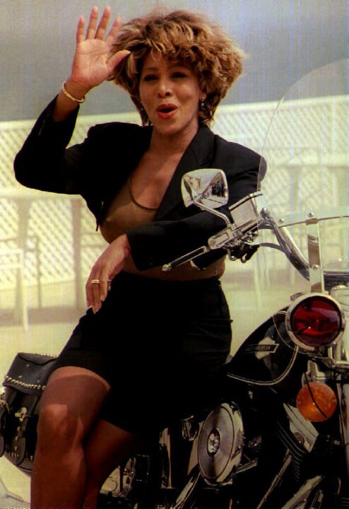 Tina Turner perched on a motorcycle poses for the cameras at the Music Awards in Monaco on 11 May 1993. (Photo by JACQUES SOFFER / AFP)