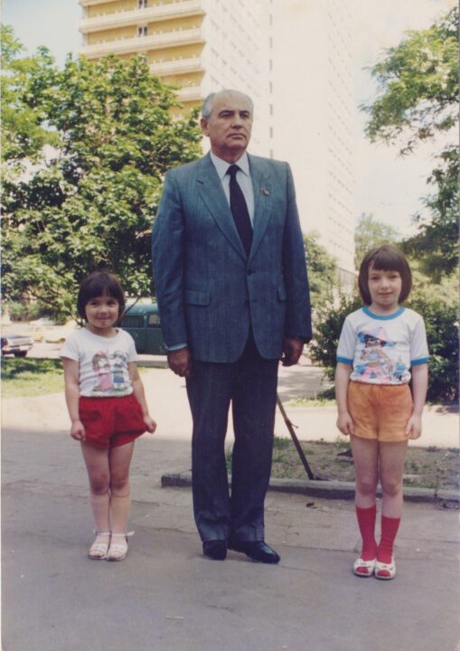 Photo of Zhanna Slor and Dina Polyakov next to cutout of Gorbachev, taken in 1989 in Moscow