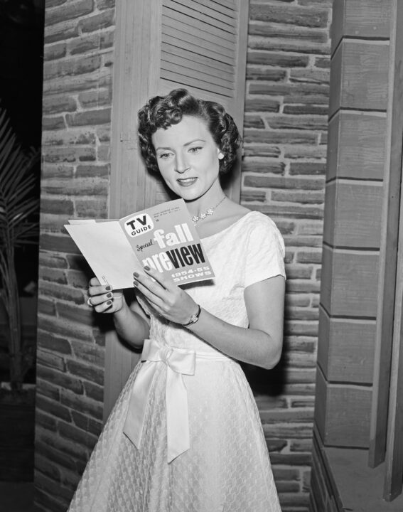 LIFE WITH ELIZABETH, Betty White, holding the 1954-55 Fall Preview Edition (Sept. 25 - October 1, 1954), of TV GUIDE, on-set, (1954), 1952-55. 