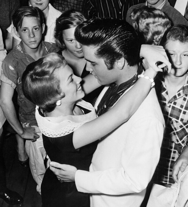 (Original Caption) 8/28/57-Memphis, Tennessee: Parting is such sweet sorrow said the bard, and singer Elvis Presley and Anita Wood are obviously in the mood to agree August 28th. Elvis was about to leave on a personal appearance tour, while Anita was hopeful of getting to movieland as a finalist in a Hollywood star hunt.