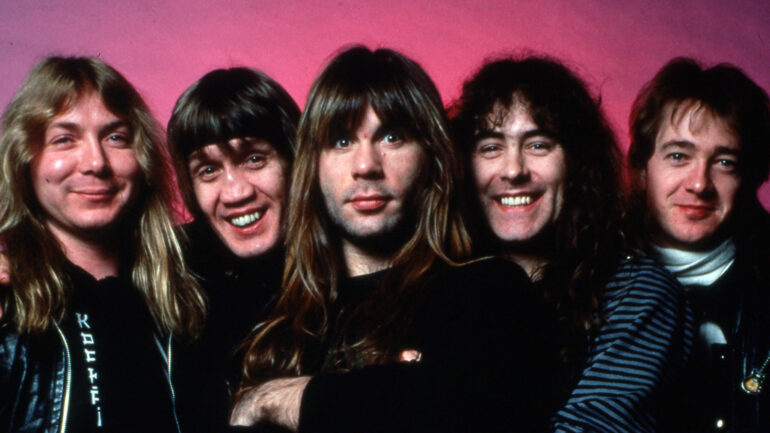 DETROIT - MARCH 18: (L-R) English songwriter and guitarist Dave Murray, English songwriter, musician and lead singer Bruce Dickenson, English drummer Nicko McBrain, English songwriter and bassist Steve Harris and English guitarist Adrian Smith, all of the heavy metal band Iron Maiden, pose for a portrait backstage at the Joe Louis Arena during the 
