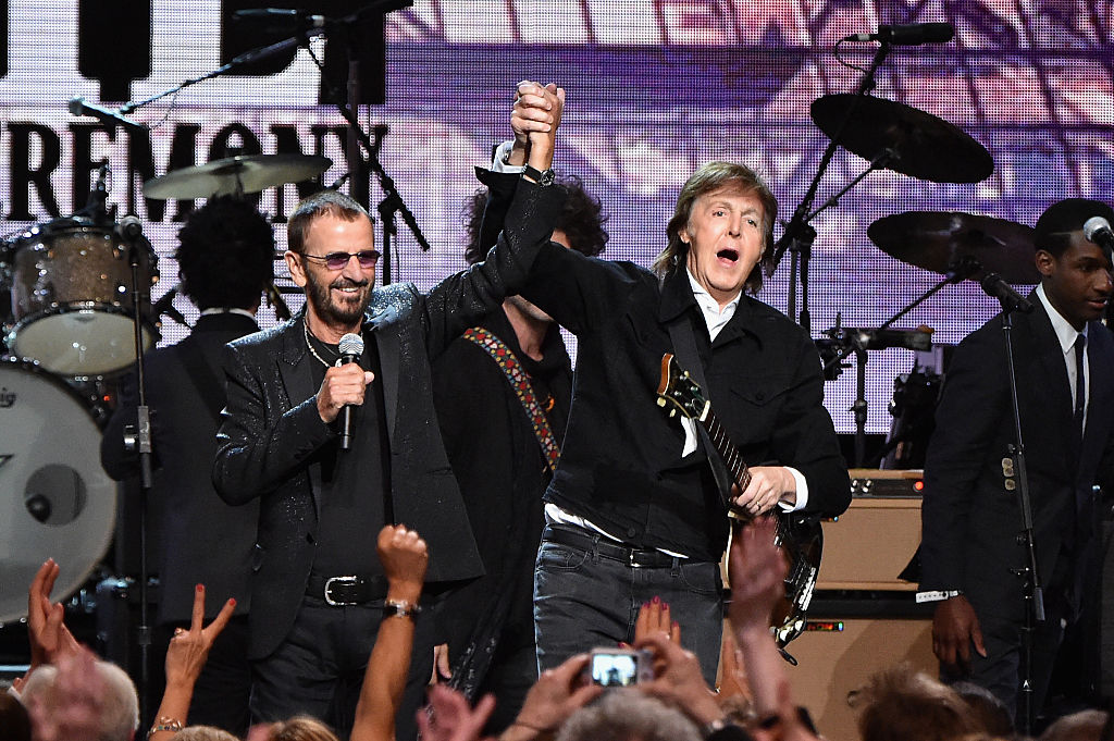 CLEVELAND, OH - APRIL 18: Sir Paul McCartney (L) and inductee Ringo Starr perform onstage during the 30th Annual Rock And Roll Hall Of Fame Induction Ceremony at Public Hall on April 18, 2015 in Cleveland, Ohio
