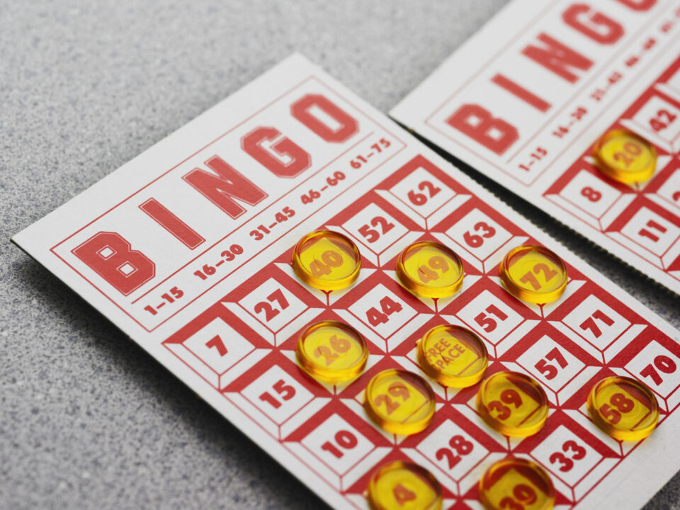 stock image of a bingo card with markers on some of the squares.