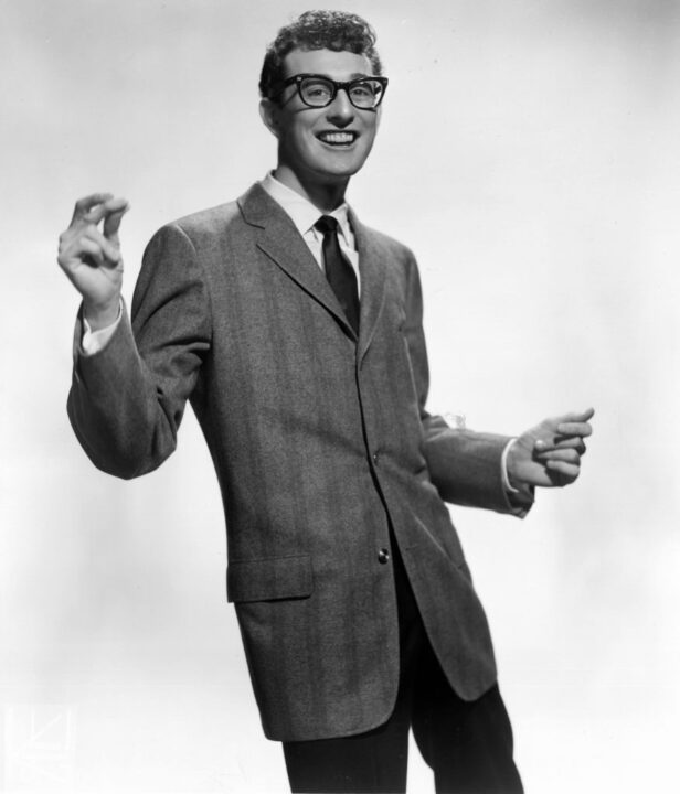 circa 1955: Rock-n-roll star Buddy Holly (1936 - 1959) snapping his fingers