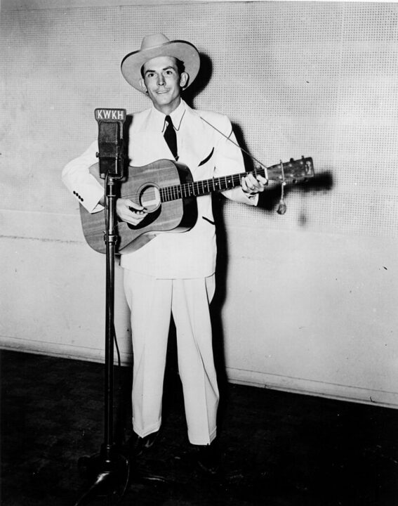 SHREVEPORT, LA - CIRCA 1947: Hank Williams performs on KWKH Radio circa 1947 in Shreveport, Louisiana