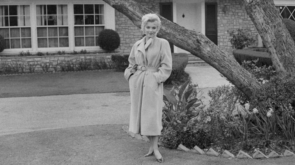 American actress Marilyn Monroe (1926 - 1962) poses outside her home during a photo call, California, USA, 1956.