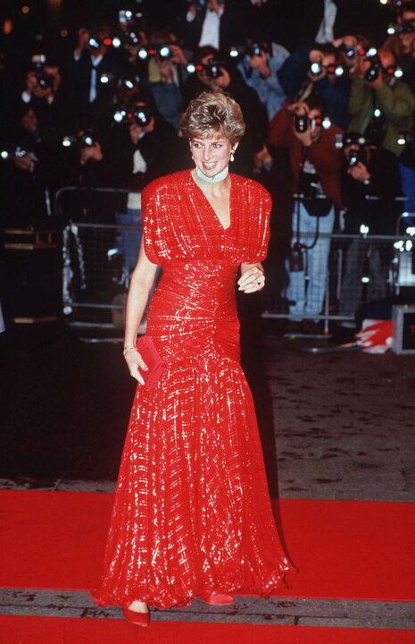 LONDON, UNITED KINGDOM - NOVEMBER 18: The Princess Of Wales Attending The Premiere Of 'hot Shots' In Leicester Square, London Being Photographed By A Big Press Corps Of Photographers. Bright Red Glitter Dress Designed By Fashion Designer Bruce Oldfield 