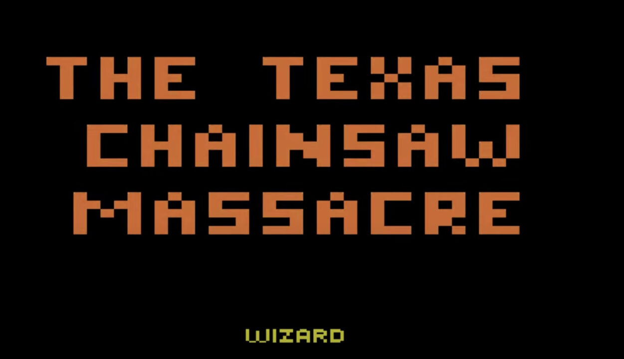 screenshot of the title screen for the 1983 Atari 2600 video game "The Texas Chainsaw Massacre," based on the horror film. In large, orange, 8-bit computer lettering reads the title of the game, taking up most of the upper part of the image. At the bottom, in smaller white lettering, reads "Wizard," the name of the company that developed the game.