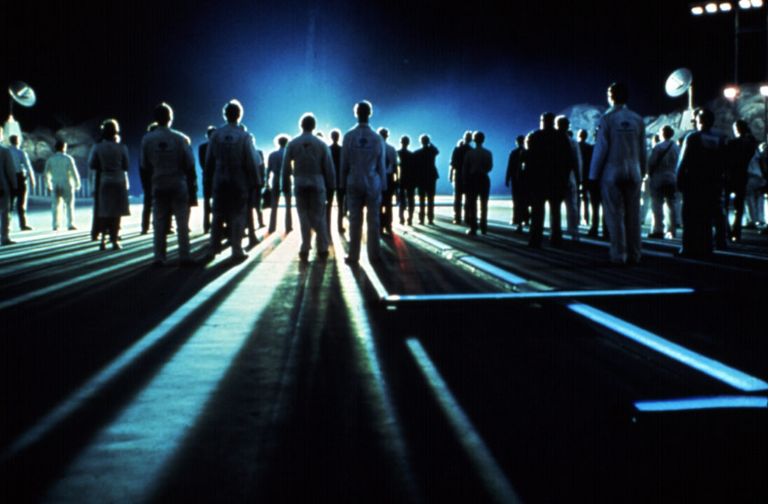 Close Encounters of the Third Kind film still of group standing in light, 1977